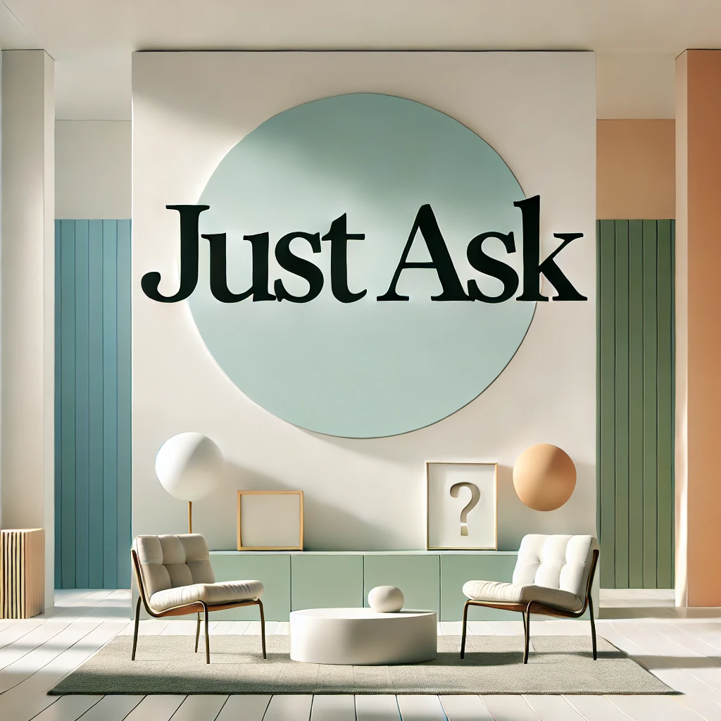 A modern, minimalist setting with bright lighting and open space featuring the text 'Just ask'